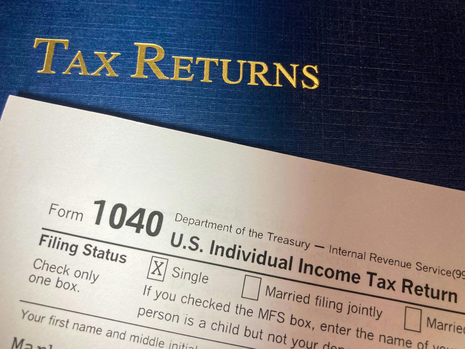 pexels photo 15116664 15116664 Close-up image of Form 1040 for U.S. tax returns, highlighting filing status options.